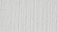 White Textured Concrete Wall with Vertical Grooves and Small Pores background Royalty Free Stock Photo