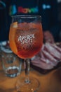 Close up of a full glass of Aperol Spritz cocktail,on an outdoor table of a restaurant Royalty Free Stock Photo