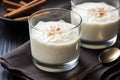 close-up of full glass of rice pudding drink with a steel spoon