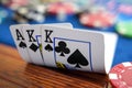 Close up of Full House Poker Hand with Aces and Kings on Casino Table with Chips Royalty Free Stock Photo