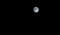Close up of full moon on dark sky background Royalty Free Stock Photo
