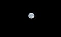Close up of full moon on dark sky background Royalty Free Stock Photo