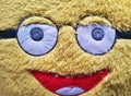 Close Up of Furry Pillow Doll Showing with Its Smiley Face