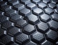 Closeup of a futuristic dark metallic hexagonal pattern with intricate textures and geometric Royalty Free Stock Photo