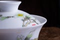 Close up of gaiwan.traditional chinese porcelian cup with sakura pattern