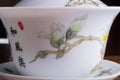 Close up of gaiwan.traditional chinese porcelian cup with sakura pattern