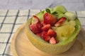 Galia melon stuffed with frui