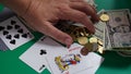 Close up of a gambler hand is holding playing cards in casino