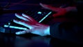 Close-up of the gamers hand movements on the glowing keyboard and mouse