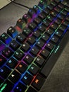 Close Up Of A Gaming Computer Keyboard, With Backlit Black Keys Changing Color, RGB Light, Selective Focus