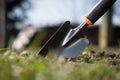 Close up of a garden shovel stabbed to soil; spring work