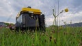 Close up of gas diesel mobile portable electricity generator work on grass. Gasoline fuel powered portable generator Royalty Free Stock Photo