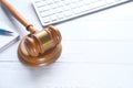 Close up of gavel, keyboard and diary on table Royalty Free Stock Photo