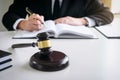 Close up of gavel, Male lawyer or judge working with Law books, Royalty Free Stock Photo