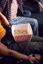 Close Up Of Gay Friends Sitting On Sofa At Home Eating Popcorn And Watching TV Together Royalty Free Stock Photo