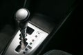 Close up gear stick interior inside bright car.