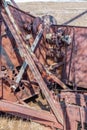 Close up of gears on vintage pull-type combine abandoned in a field in Saskatchewan, Canada