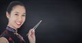 Close up of geisha with chopsticks against navy chalkboard Royalty Free Stock Photo