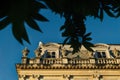 Close up of Gemini houses - casas gemelas - framed by leaves at the colonial city of Merida, Yucatan, Mexico