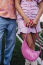 Close up gen Z couple in pink outfits before going to cinema to watch movie. Watching movie addressing the topic of Royalty Free Stock Photo