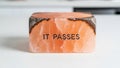 It Passes: Himalayan Salt Block with Inscription Royalty Free Stock Photo