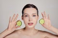 Close up gentle sophisticated calm girl in a moisturizing mask with a fresh cucumber on the face Royalty Free Stock Photo