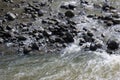 Gently rushing water over slippery, wet pebbles at Ho\'olawa Stream in Haiku, Maui on the road to Hana