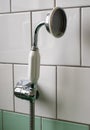 Close up of original green vintage retro 1930s deco stainless steel shower head. Royalty Free Stock Photo