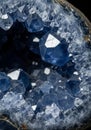 Close-up of a geode showcasing deep blue crystals, likely celestite (SrSO?). The geode Royalty Free Stock Photo