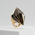 Close Up Geometric Gold Ring with Black Gem on a White Surface Jewelry Still Royalty Free Stock Photo