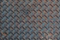 Close up geometric pattern of a metal manhole cover Royalty Free Stock Photo