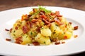 close-up of german-style potato salad with bacon bits