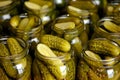Close-up of gherkins in glass jar with brine and spices. Royalty Free Stock Photo