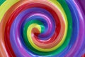 Close up of a giant lollipop swirl of colors.