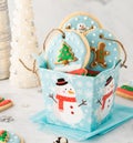 Close up of a gift box filled with homemade snow globe cookies. Royalty Free Stock Photo
