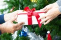 Close up of gift box giving by senior couple during Christmas Royalty Free Stock Photo