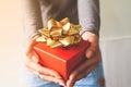 Close up gift box on woman hands. Thanksgiving or Christmas