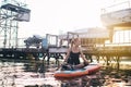 Close-up of a girl doing yoga on sub board. Psychology meditation, relaxation and self-healing concept. Lonely woman alone on