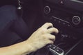 Close up of girl driving car moving transmission shift gear. Concept of female driving car. Using vehicle with modern automatic Royalty Free Stock Photo