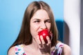 Close-up of a girl eating a red apple Royalty Free Stock Photo