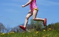 Close up of girl feet jumping sprinkle water outside and having fun Royalty Free Stock Photo