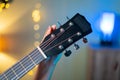 Close up of girl hand tuning Acoustic Guitar by changing headstock before practicing Royalty Free Stock Photo