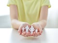 Close up of girl hands with paper family cutout Royalty Free Stock Photo