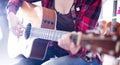 Close-up girl holding guitar. Royalty Free Stock Photo