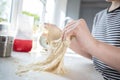 Close Up Of Portrait Of Girl With Messy Hands Having Fun In Kitchen Kneading Dough For Baking