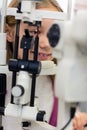 Close up girl on ophthalmoscope