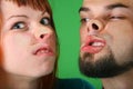 Close up girl with red hair and guy grimace mash