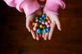 Bunch of candies in child`s hands Royalty Free Stock Photo