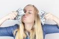 Close-up of a girl sniffing money. Madness and greed from currency. The concept of corruption and getting money at any cost.