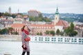 Close-up girl against blurred view of Buda side at Budapest